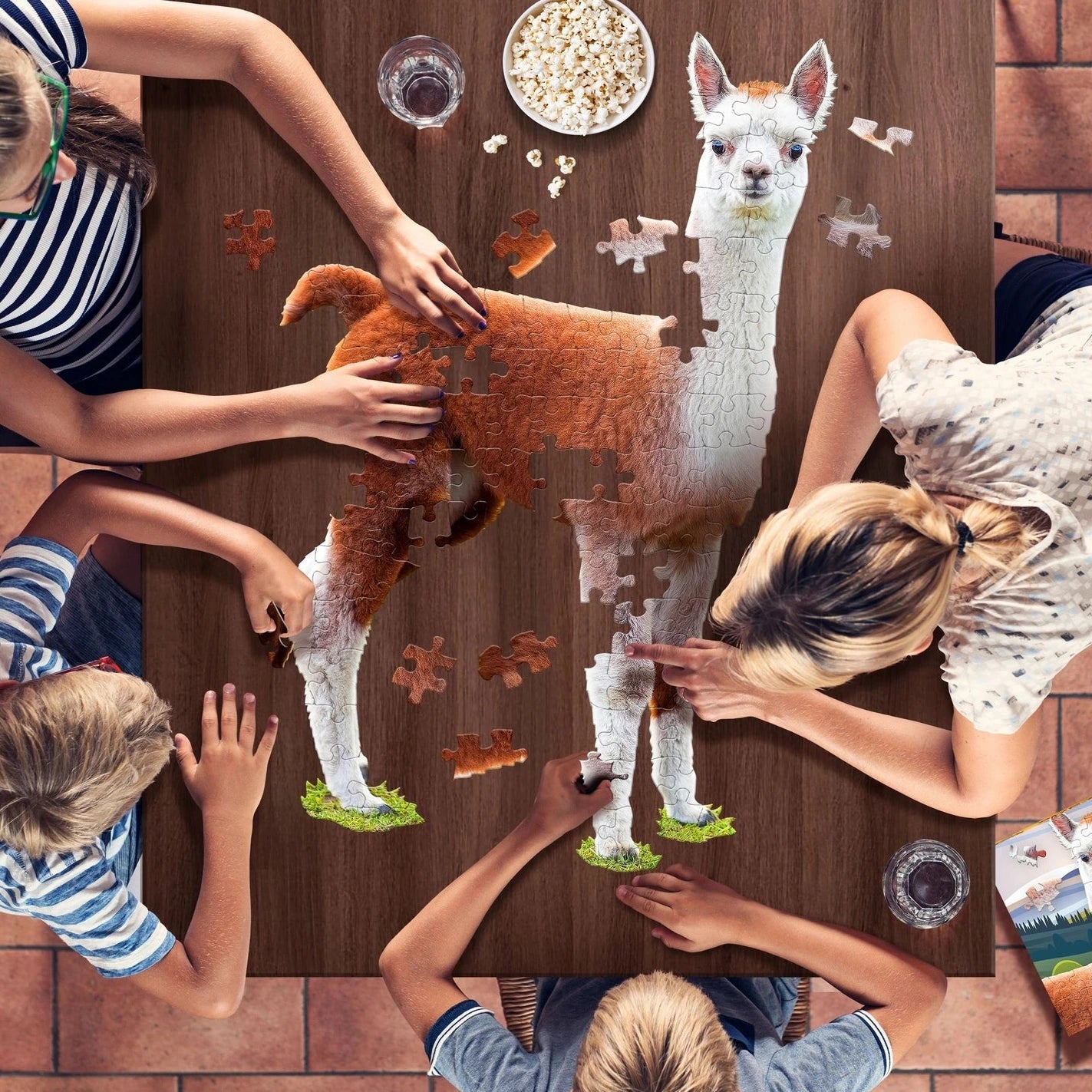 Children playing with a puzzle of an alpaca on a wooden table.